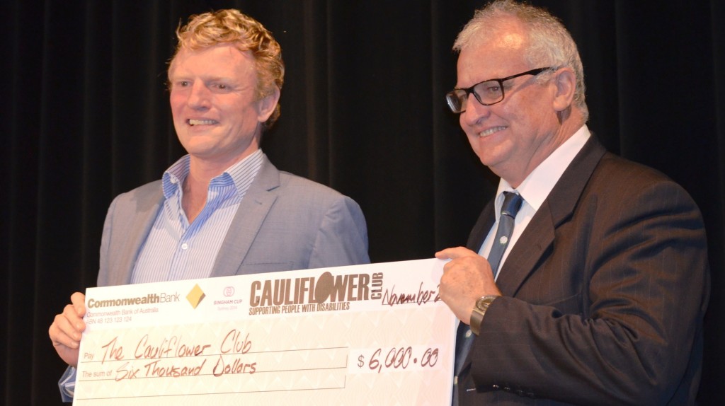 Bingham Cup Sydney 2014 President Andrew Purchas presents a $6000 cheque for the Cauliflower Club to Wallabies and international rugby legend David Campese