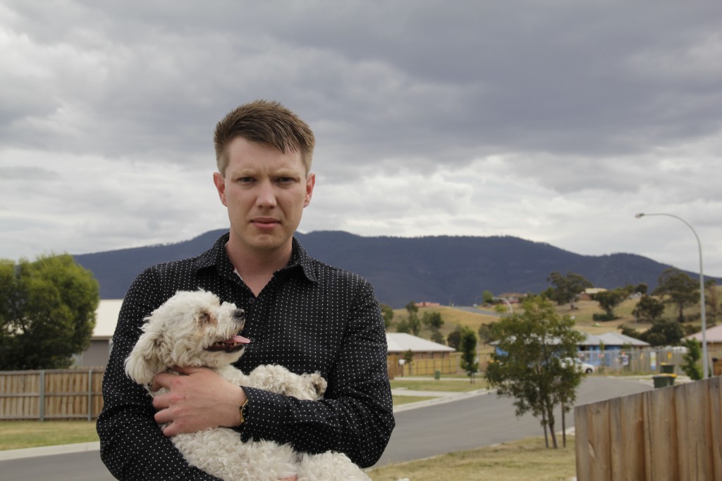 Ben Jago with one of the dogs he raised with partner Nathan Lunson, who died this year. (Supplied photo)