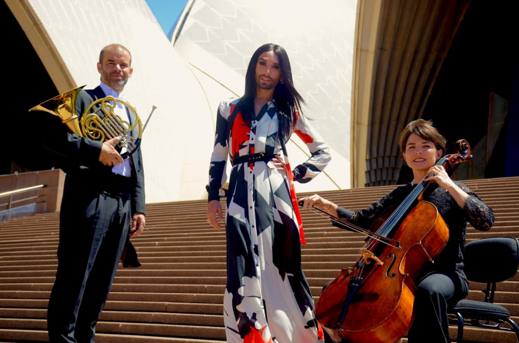 Conchita Wurst, who has been in Australia the past few days for Adelaide's Feast Festival, will return to Australia once again early 2016 as part of the Sydney Gay and Lesbian Mardi Gras festival line-up. Pictured here with members of the Sydney Symphony Orchestra, with whom she'll share the stage for a one-off concert night in March. (PHOTO: David Alexander; Star Observer)