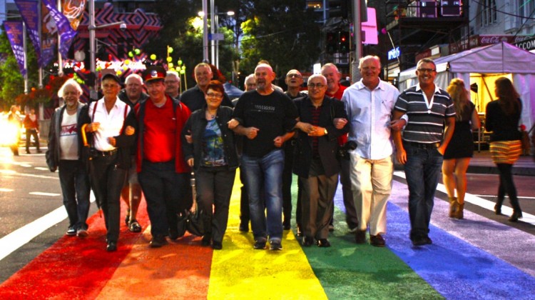 A group of 78ers walk across the rainbow crossing at Taylor Square. (Photo: Steve McLaren)