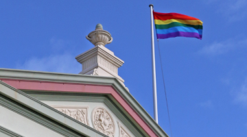 The rainbow flag flying atop Randwick Town Hall to celebrate Mardi Gras season (PHOTO: Benedict Brook; Star Observer)