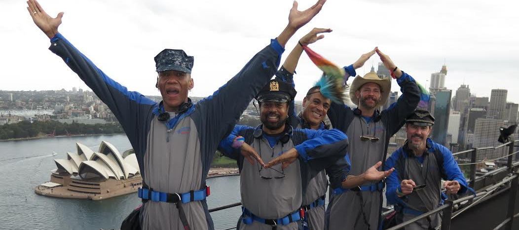 The Village People perform the YMCA on top of the Sydney Harbour Bridge as part of the Mardi Gras Disco Climb for Sydney Gay and Lesbian Mardi Gras. (Supplied photo)