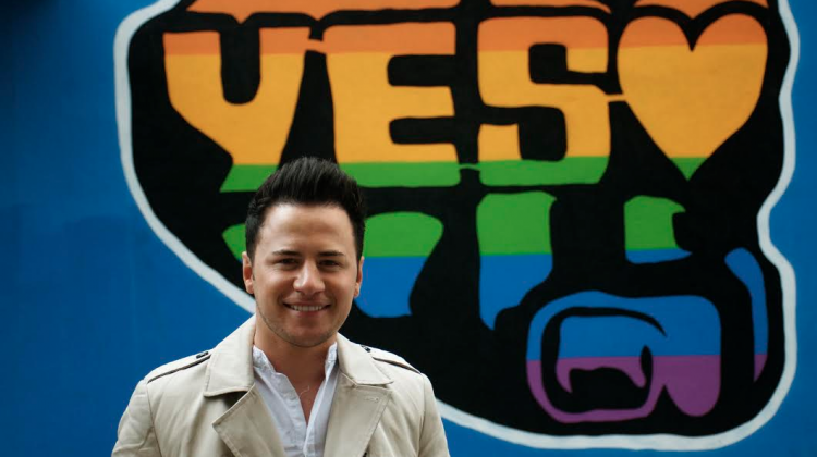 Ryan Dolan poses for the camera in front of a "Yes" poster in Ireland, ahead of the May 22 referendum for marriage equality. (PHOTO: David Alexander; Star Observer)