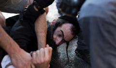 The suspect is arrested shortly after he stormed the Jerusalem Gay Pride marchers.