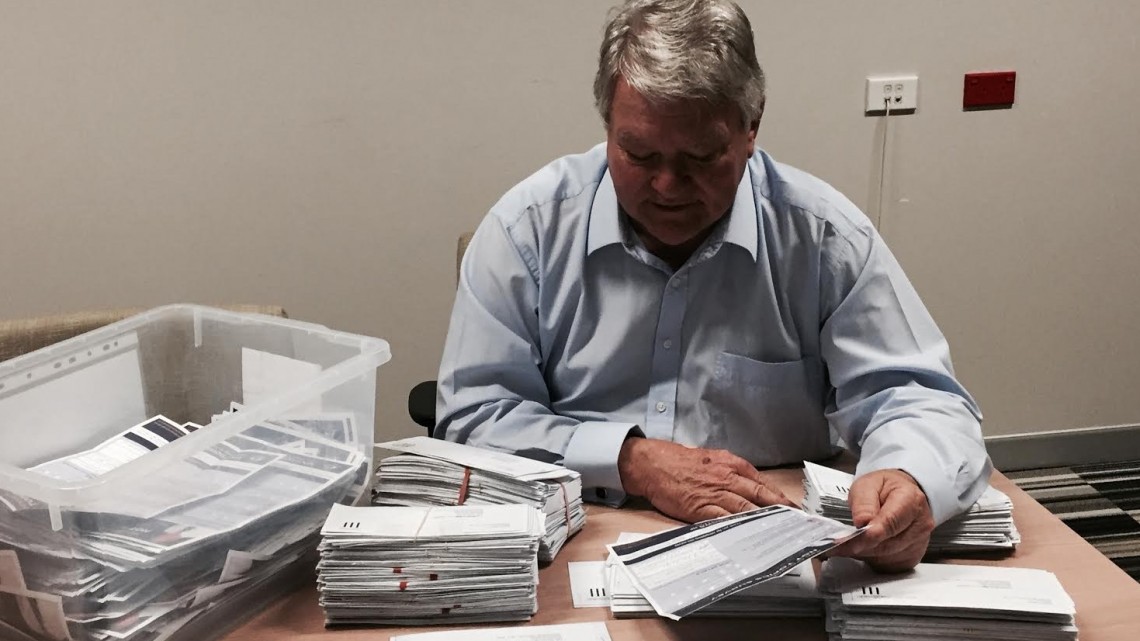 Flynn federal Nationals MP Ken O’Dowd counting the returned surveys (Supplied photo)