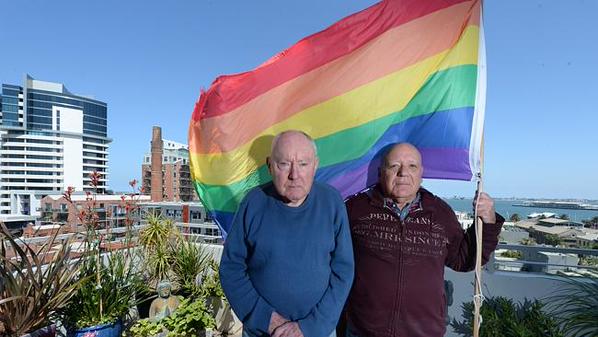 Murray Sheldrick, 78, and James Bellia, 72, were ordered to take down their rainbow flag from their Port Melbourne apartment balcony. (Image via Twitter)