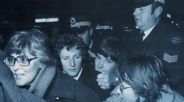 Gail Hewison (far left) just seconds before arrest at the first Mardi Gras in 1978. She said the police officer behind grabbed her by her hair and dragged her across the road and tossed her head first into paddy wagon. (Image supplied by Gail Hewison)