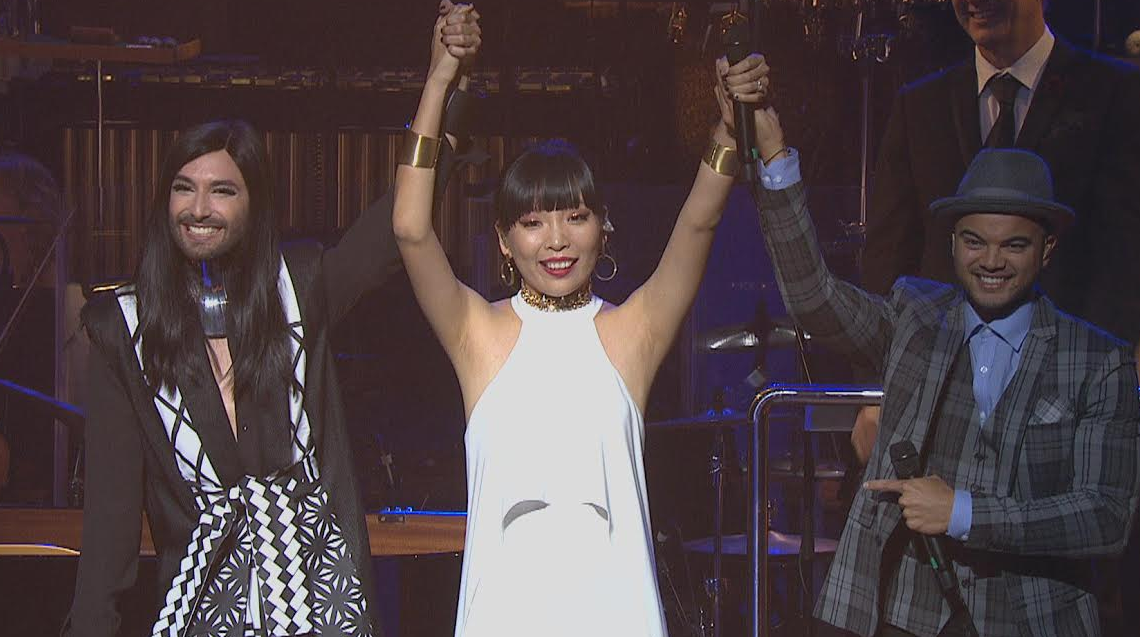 Dami Im (centre) when she was announced at Australia's representative for the 2016 Eurovision Song Contest in Stockholm, Sweden last night at the Sydney Opera House. Pictured with Eurovision 2014 winner Conchita Wurst (left) and Australian Eurovision 2015 contestant Guy Sebastian (right).