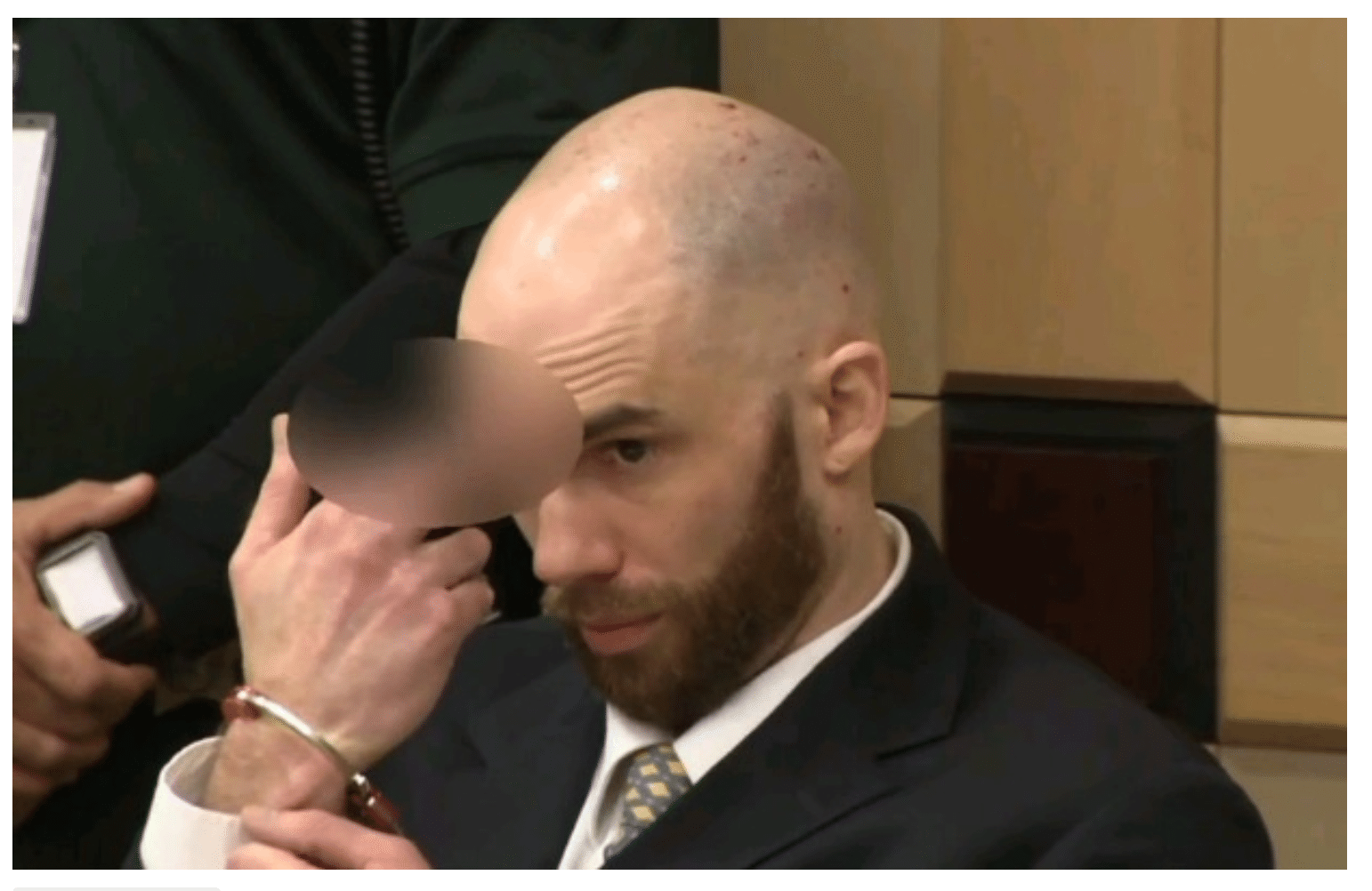 Killer of gay couple flips off victims’ families in court
