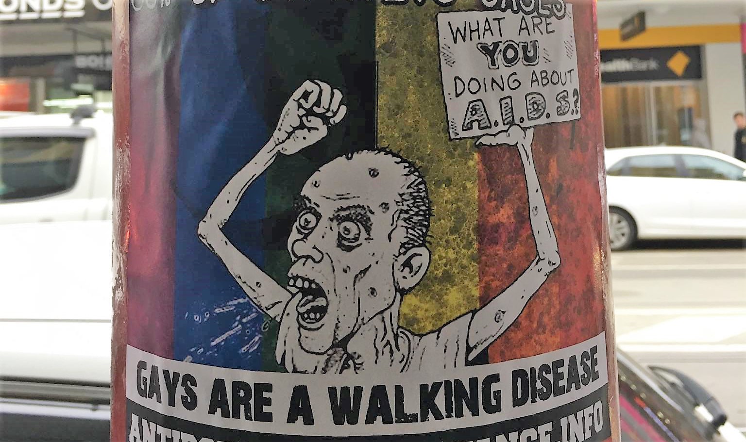 Nazi group plasters Melbourne street with “Happy AIDS Month” posters