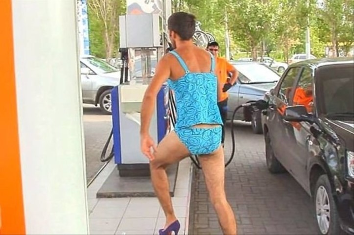 Russian men don bikinis, high heels for free fuel