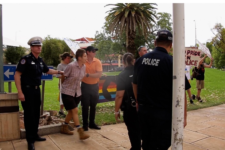 Queer Activist Meret MacDonald was arrested by the Northern Territory Police at the FABalice rainbow flag raising ceremony outside Alice Springs police station on March 12, 2021. (Photo Supplied)