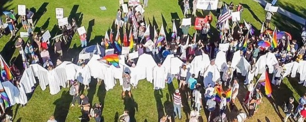 ‘Angels’ Protect LGBT Students From Homophobic Protestors At Pride March
