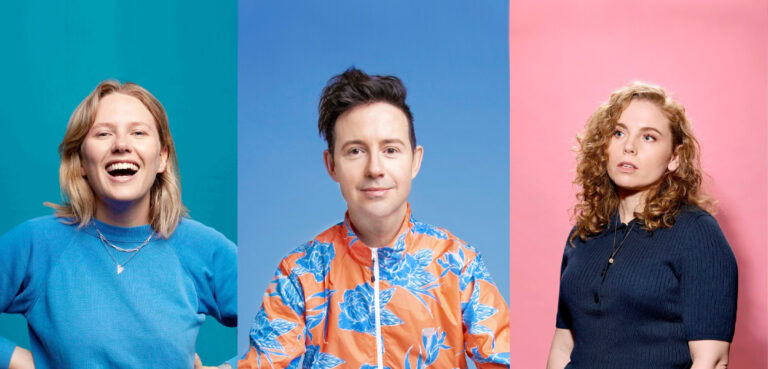 Three separate photos of comedians Jordan Barr, Nath Valvo and Bronwyn Kuss. Jordan Barr is laughing at the camera wearing a blue teeshirt on a teal background, Nath Valvo is smiling at the camera wearing an orange and blue floral print zip-up windcheater, Bronwyn Kuss is looking to the top left, wearing a navy knit polo on a pink background.