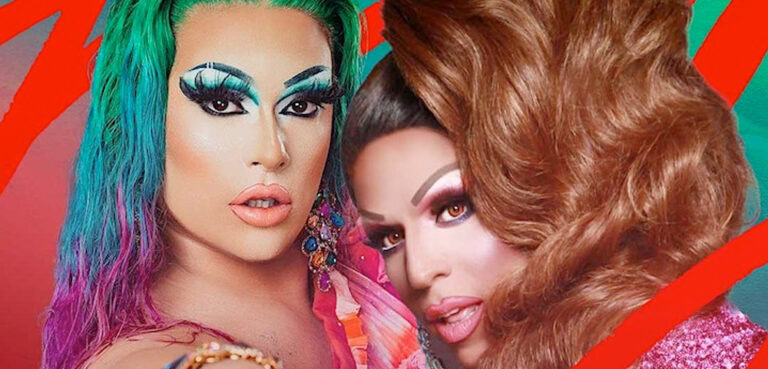 Two drag queens on a neon orange background, Selina is to the left, wearing a green-teal-purple ombre wig and matching teal eye makeup, Jessica is nestled into her shoulder wearing a lightly curly brown wig and pearlescent pink eye makeup and lipstick