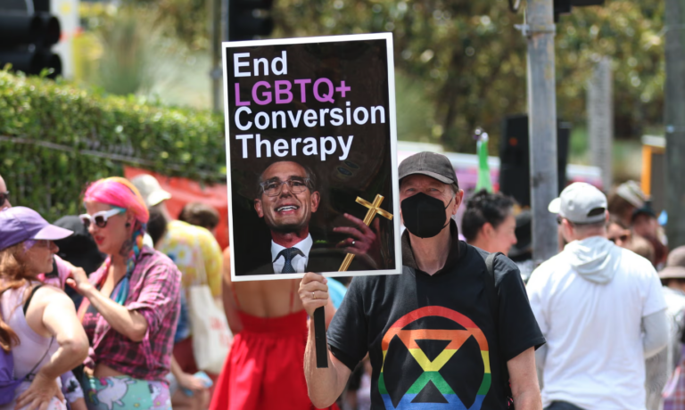 Anti-LGBTIQ+ discrimination protestor at Mardi Gras rally in 2023.